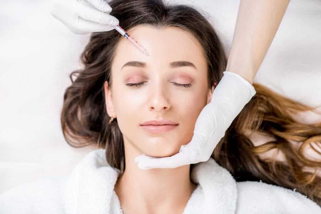 Woman receiving a botox injection on forehead | ReViVe Aesthetics and Healthcare in Rockwall, TX