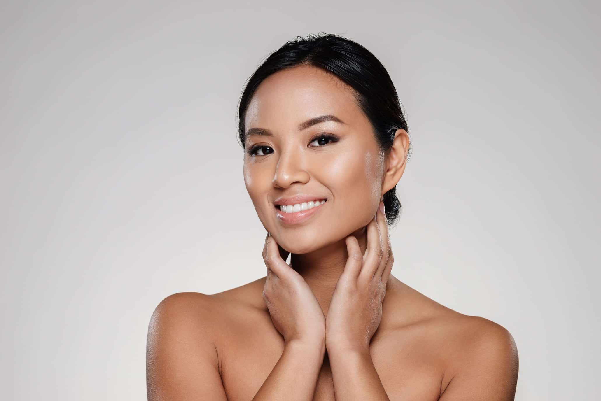 Beauty portrait of a happy half naked asian woman looking at camera | ReViVe Aesthetics and Healthcare in Rockwall, TX