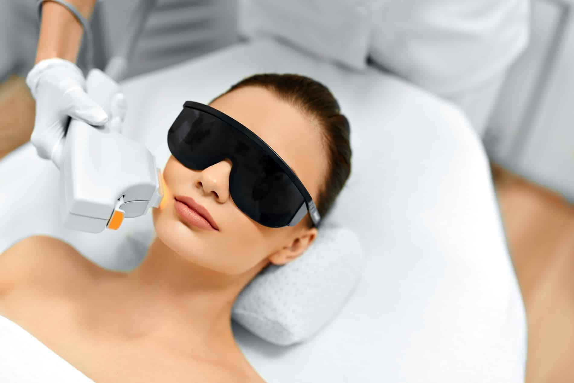 a woman getting laser treatment