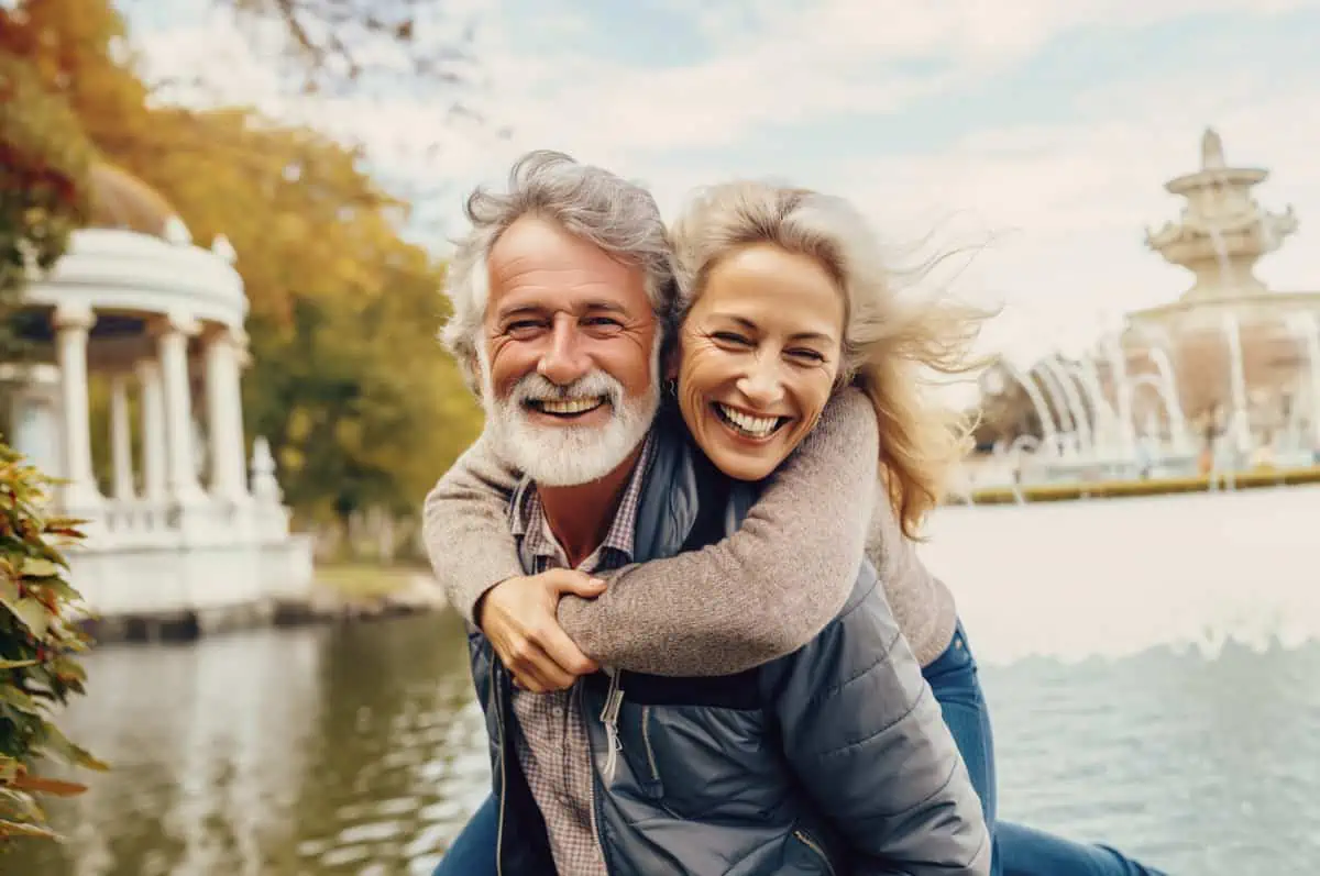 a man giving a woman a piggy back ride