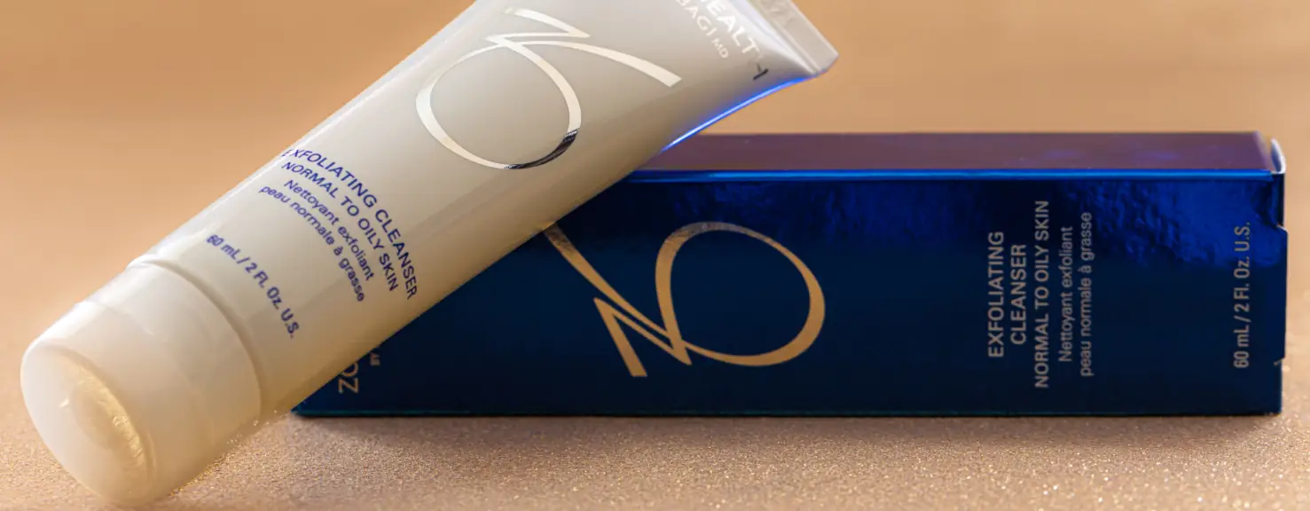 a white tube of cream on a blue box