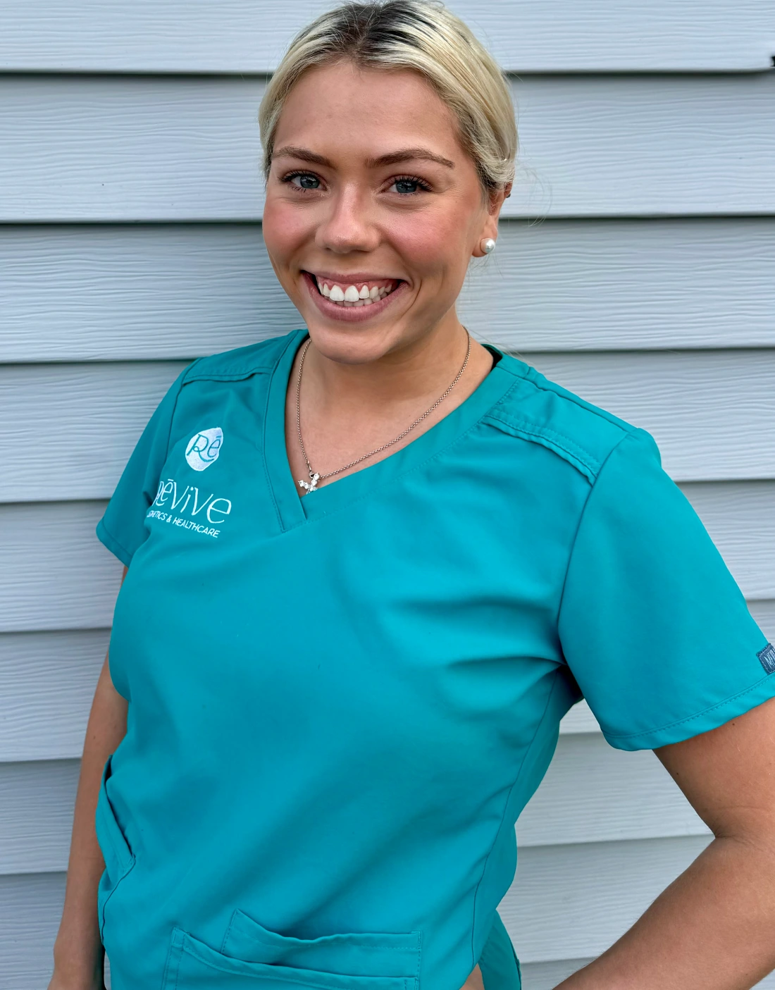 a woman in a blue scrubs