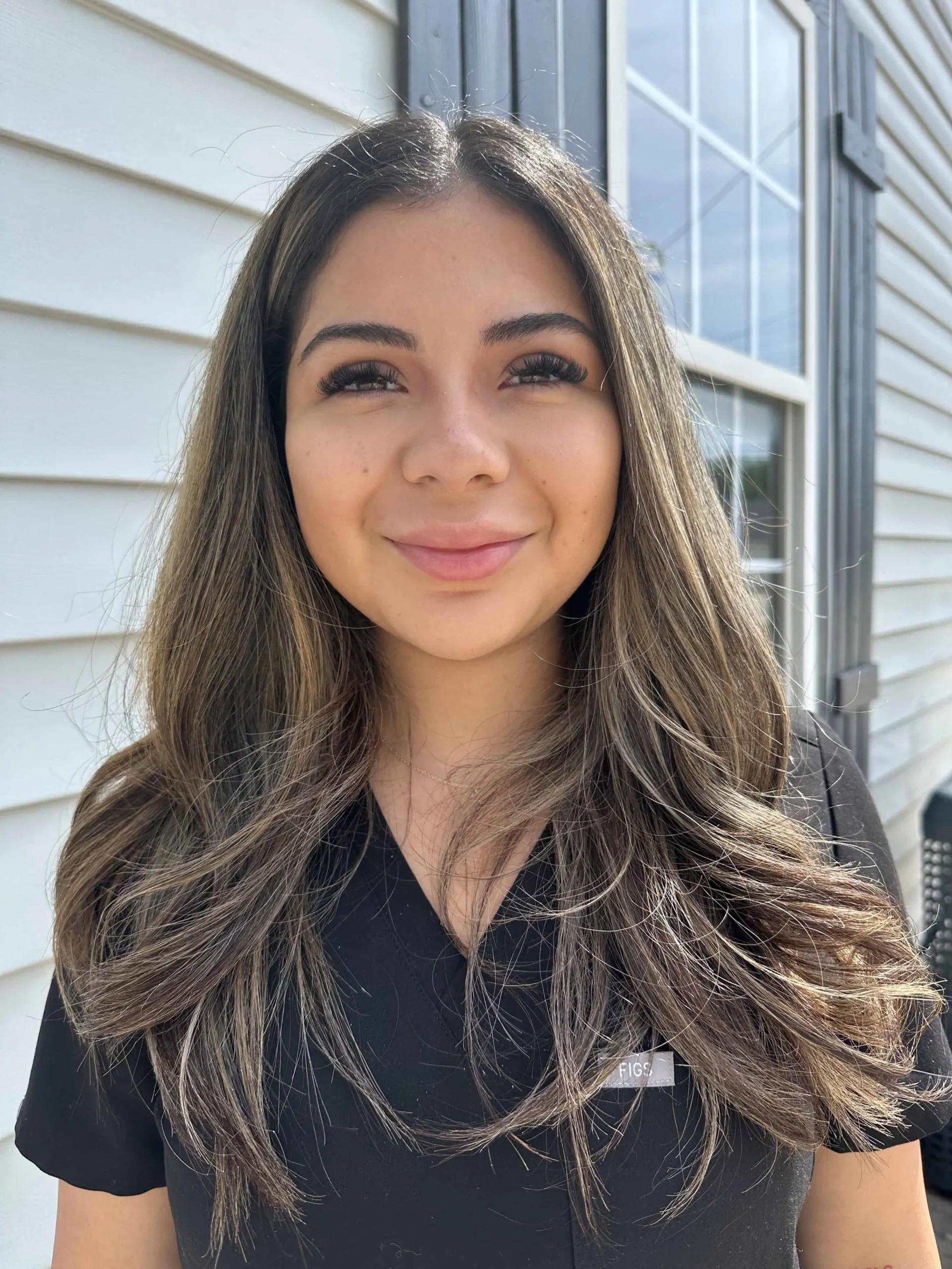 a woman smiling for a picture