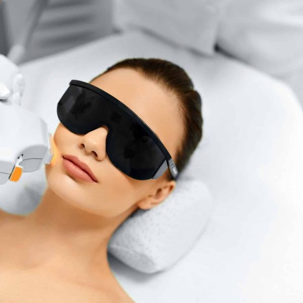 a woman getting laser treatment